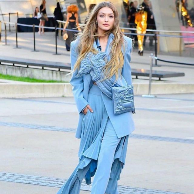 Blue trousers and pleated skirt worn by Gigi Hadid at the CFDA event 03.06.2019