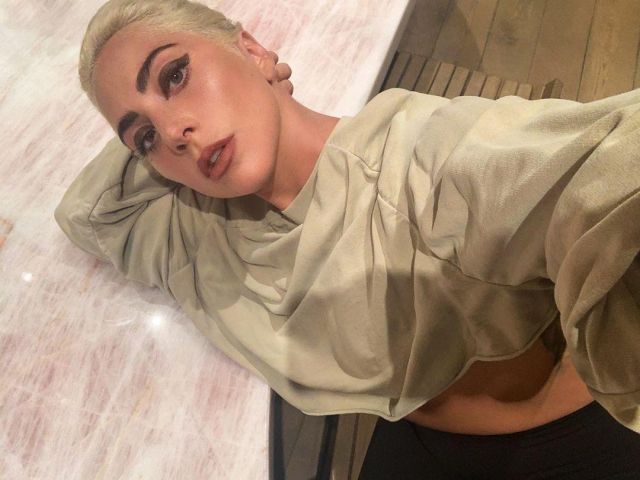 Oversized tan crop hoodie of Lady Gaga on the Instagram account @ladygaga