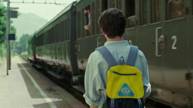The yellow Invicta backpack worn by Elio Perlman (Timothée Chalamet) in the movie Call me by your name
