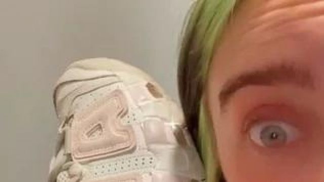Nike Air More Uptempo 'Barely Green' held by Billie Eilish on her Instagram Story