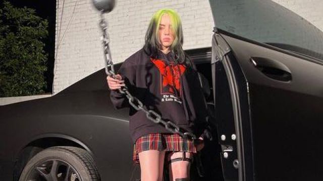 Dolls Kill Crim­son Dress Code Plaid Skirt worn by Billie Eilish on the Instagram account of @Blohsh