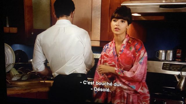 New Girl's Looks: Aly Nelson (Nasim Pedrad) wears a colorful print dressing gown from Natori in Season 2, Episode 24 of the series