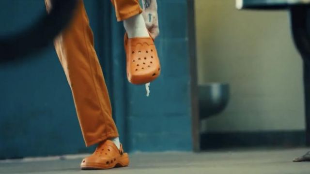 Orange Crocs sabot slipper shoes worn by Blackguard (Pete Davidson) as seen in The Suicide Squad movie