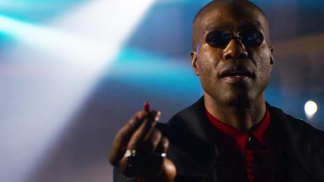 Red pill offered by Morpheus (Yahya Abdul-Mateen II) as seen in The Matrix Resurrections movie
