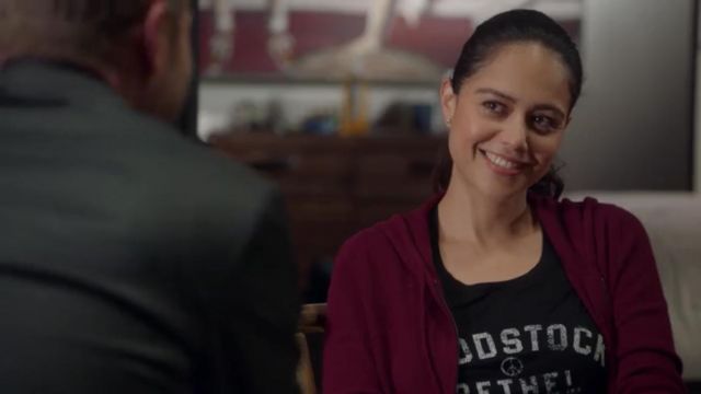 Woodstock Bethel New York T-Shirt worn by Angela Lopez (Alyssa Diaz) as seen in The Rookie Wardrobe (Season 4 Episode 3)