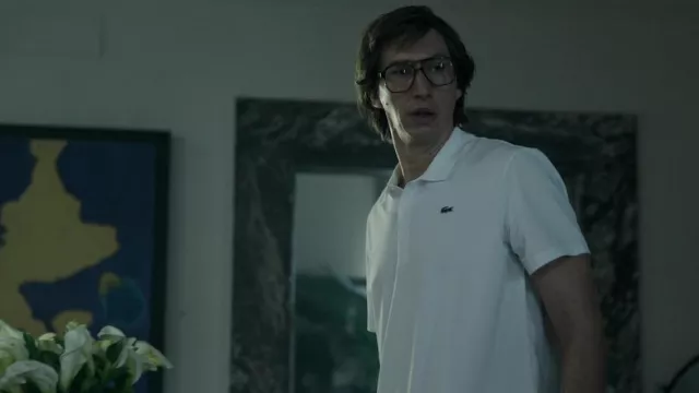 Lacoste white polo shirt worn by Maurizio Gucci (Adam Driver) as seen in House of Gucci wardrobe