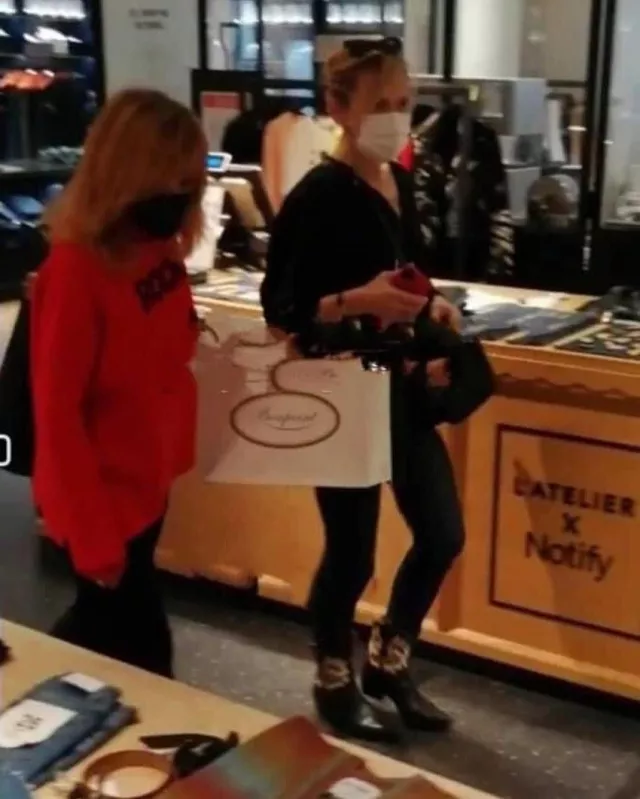 The Zadig &amp; Voltaire &quot;Rock &amp; Roll&quot; red sweater by Mylène Farmer during a shopping session at the Bon Marché Rive Gauche in Paris in October 2021