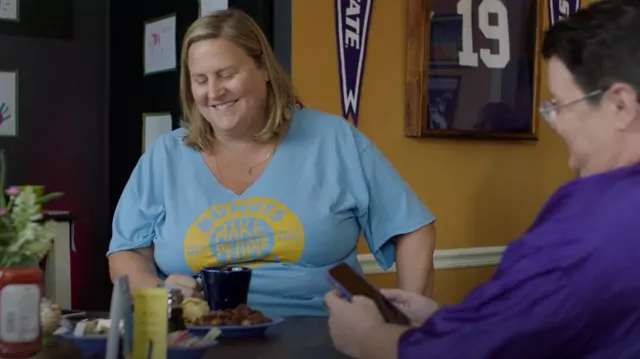 Donuts Make People Happy T-shirt in blue worn by Sam (Bridget Everett) in Somebody Somewhere TV show wardrobe (Season 1)