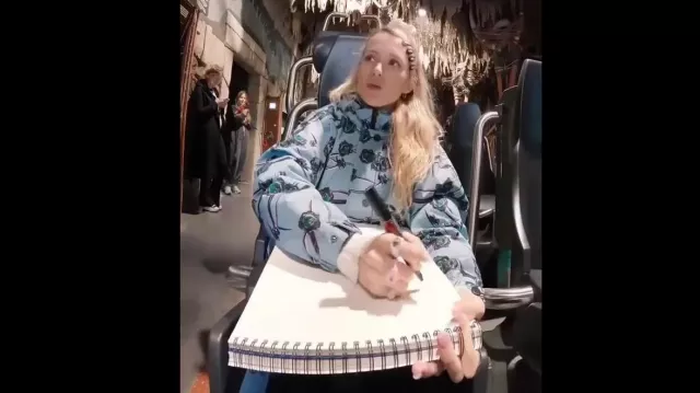 Blue printed jacket worn by Angèle in la chanteuse ANGELE dans le Kondaa de Walibi Belgium YouTube video