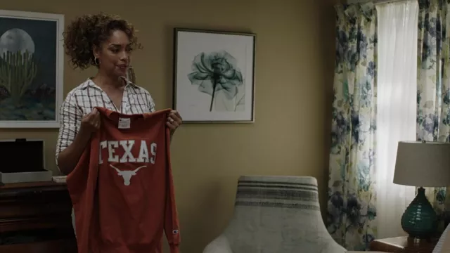 Champion Texas Longhorns Orange Arch Powerblend Hoodie Sweatshirt held by Tommy Vega (Gina Torres) in 9-1-1: Lone Star (S03E17)