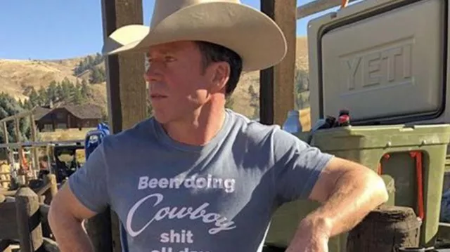 Cowboy Been Doing Cowboy shit all day T-Shirt in grey worn by Travis (Taylor Sheridan) in Yellowstone Wardrobe (Season 3 Episode 10)
