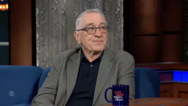 Navy Blue polo shirt worn by Robert De Niro as seen in The Late Show with Stephen Colbert on June 7, 2022