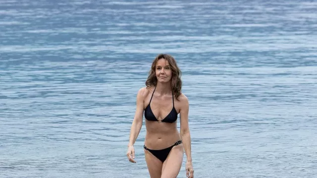 The black bikini worn by Sylvie Grateau (Philippine Leroy-Beaulieu) in the series Emily in Paris (Season 2 Episode 2)