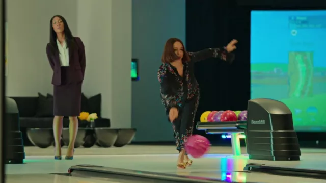 Erdem pants and shirt set in black floral worn by Molly Novak (Maya Rudolph) as seen in Loot (S01E03)