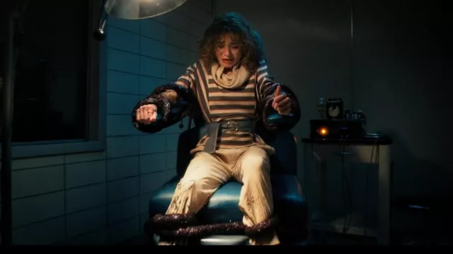 Striped sweater and oversize pants worn by Nancy Wheeler (Natalia Dyer) as seen in Stranger Things (Season 4 Episode 8)