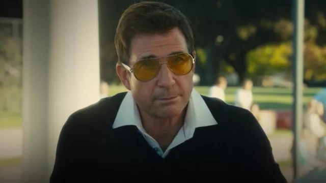 Sunglasses with yellow lenses, silver frame, carbon fiber arms, aviator style, gold piece on side with monogram worn by George Macarthur (Dylan McDermott) in King Richard