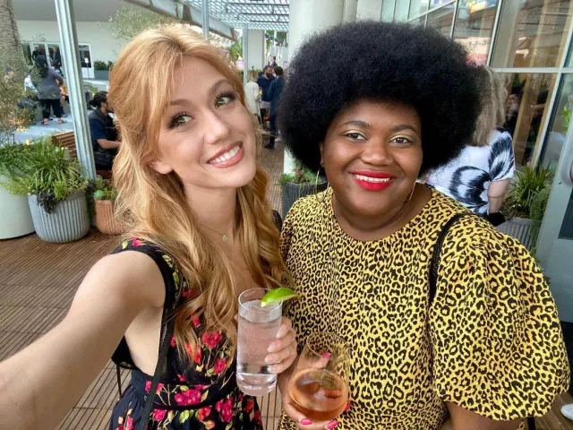 Katherine McNamara's heeled shoes and floral dress on her Instagram account @kat.mcnamara