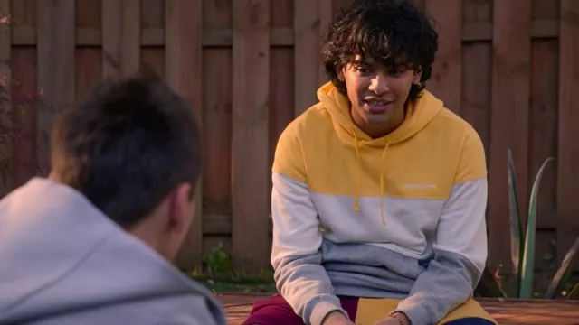 Primitive Yellow and grey sport hoodie worn by Miguel Diaz (Xolo Maridueña) in Cobra Kai TV series outfits (Season 5 Episode 7)