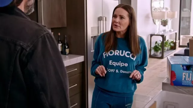 Fiorucci Equipe Lo­go Velour Jog­gers Blue worn by Lisa Barlow as seen in The Real Housewives of Salt Lake City (S03E01)