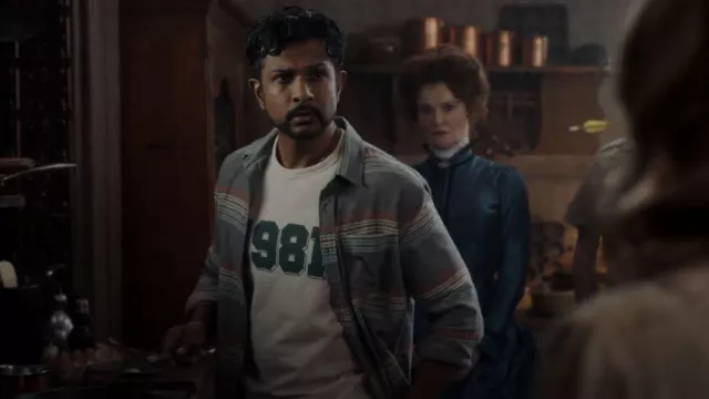 Mango Cotton Varsity T Shirt worn by Jay (Utkarsh Ambudkar) as seen in Ghosts (S02E04)