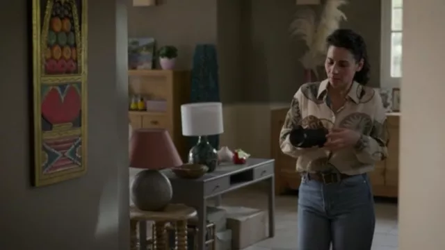 Fabienne's (Cécile Rebboah) mass-print Massimo Dutti medal-print blouse in Addict (S01E01)