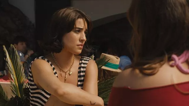 Luna Flo London Necklace with gold charms worn by Lucia (Simona Tabasco) in The White Lotus TV series (S02E04)