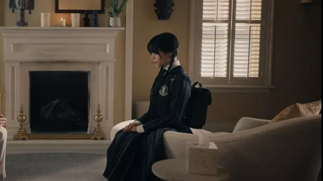 Cambridge Satchel Small Portrait Backpack in black worn by Wednesday Addams (Jenna Ortega) as seen in Wednesday (Season 1 Episode 1)
