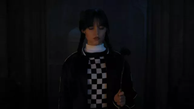 Urban Outfitters Checkmate Sweater worn by Wednesday Addams (Jenna Ortega) as seen in Wednesday (S01E07)
