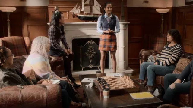 X-Girl at Dolls Kill Orange Plaid Mini Skirt worn by Bela Malhotra (Amrit Kaur) as seen in The Sex Lives of College Girls (S02E09)