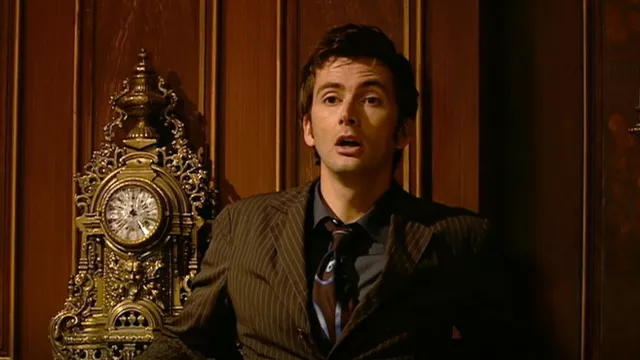 Christian Lacroix Brown Tie with Blue Swirl Pat­tern worn by The Doctor (David Tennant) as seen in Doctor Who (S02E04)