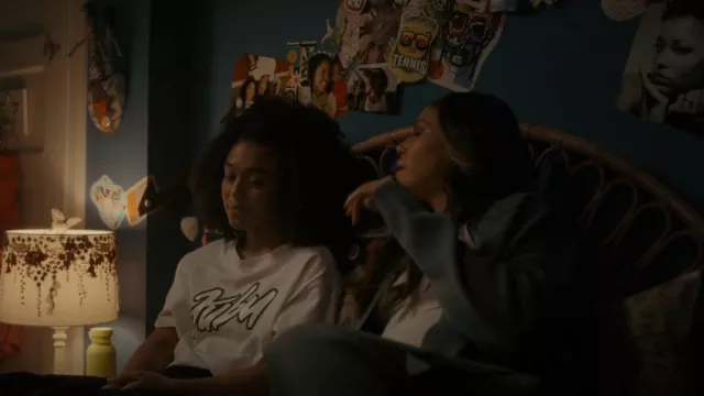 Fubu Graphic Cropped Tee worn by Trini Killebrew (Mychala Lee) as seen in Truth Be Told (S03E02)