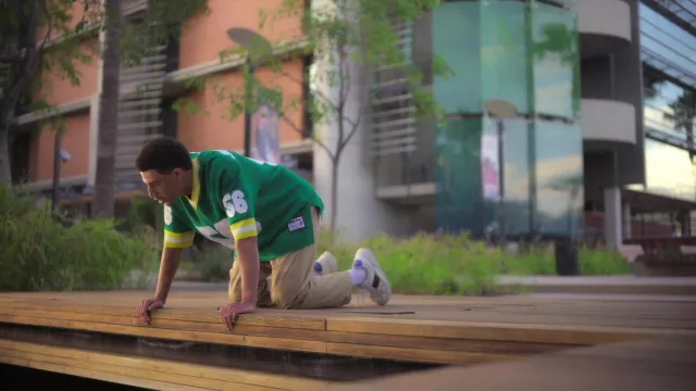 Just Don Football Jersey Number 56 in green worn by Andre Johnson, Jr. (Marcus Scribner) in grown-ish TV series (S05E15)
