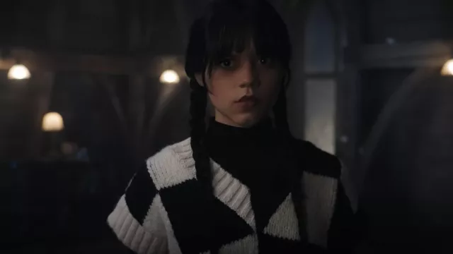 Check vest in black and white worn by Wednesday Addams (Jenna Ortega) in Wednesday TV show outfits (Season 1 Episode 7)
