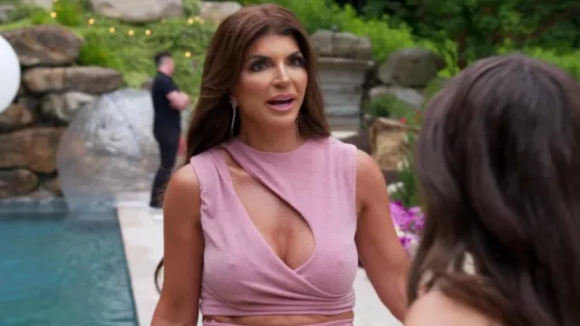 Miss Circle Teia Salmon Pink Metallic Jersey Cutout Top worn by Teresa Giudice as seen in The Real Housewives of New Jersey (S13E04)