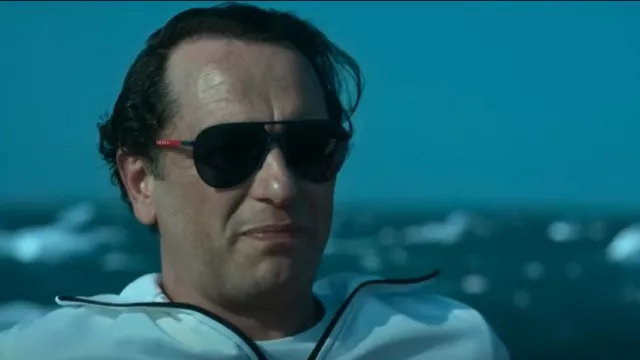 Prada Sport Men's Steel Avi­a­tor Lo­go Sun­glass­es worn by Junior (Matthew Rhys) as seen in Extrapolations (S01E01)