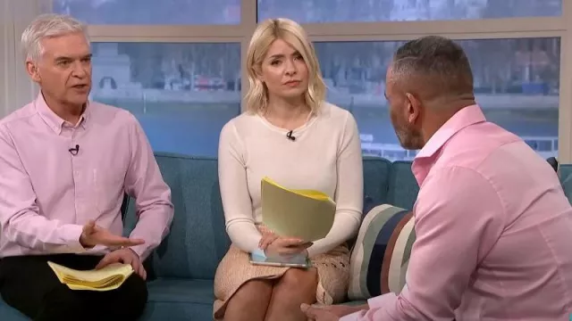 Karen Millen Tweed Wrap Detail Midiaxi Skirt worn by Holly Willoughby as seen in This Morning on March 20, 2023