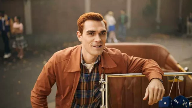 Orange rust zip jacket worn by Archie Andrews (KJ Apa) as seen in Riverdale TV show outfits (Season 7 Episode 1)