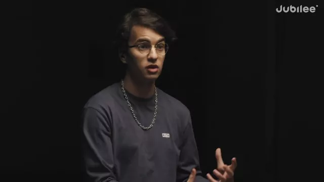 Ray-Ban glasses in gold worn by Amr in Can Satanists & Major Religions See Eye to Eye? | Middle Ground