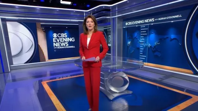 Alexander McQueen Mid-Rise Flared Pants worn by Norah O'Donnell as seen in CBS Evening News on May 18, 2023