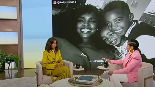 Saint Laurent Hooded Jacket In Crepe Satin worn by Kelly Rowland as seen in Tamron Hall on June 2, 2023