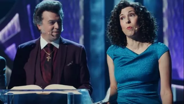Talbot Runhof Roy­al Metal­lic Teal Off-The-Shoul­der Dress worn by Judy Gemstone (Edi Patterson) as seen in The Righteous Gemstones (S02E07)