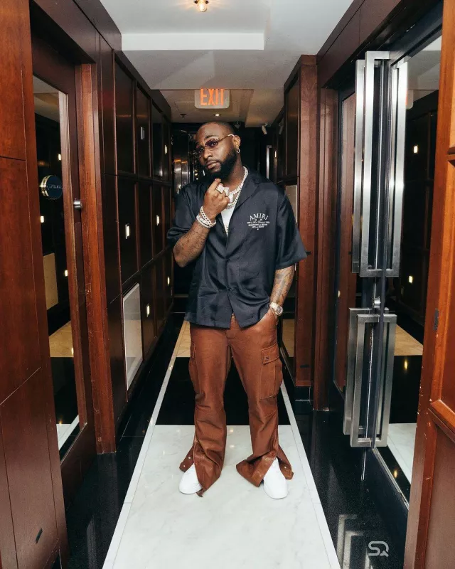 Amiri Brown Leather Flared Cargo Pants worn by Davido on his Instagram account @davido