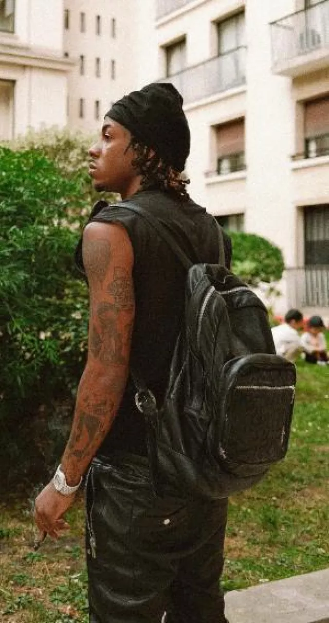 Chrome Hearts Black Leather Cross Pocket Backpack worn by Rich the Kid on the Instagram account @richthekid