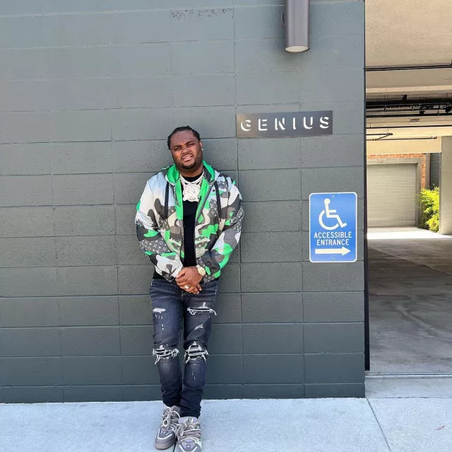 Louis Vuitton Grey & Green Face Patch­work Jack­et worn by Tee Grizzley on his Instagram account @teegrizzley