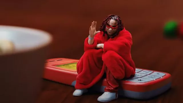 Balenciaga Red Faux Fur Oversized Bomber Jacket worn by Trippie Redd in Closed Doors (Music Video) with Roddy Ricch
