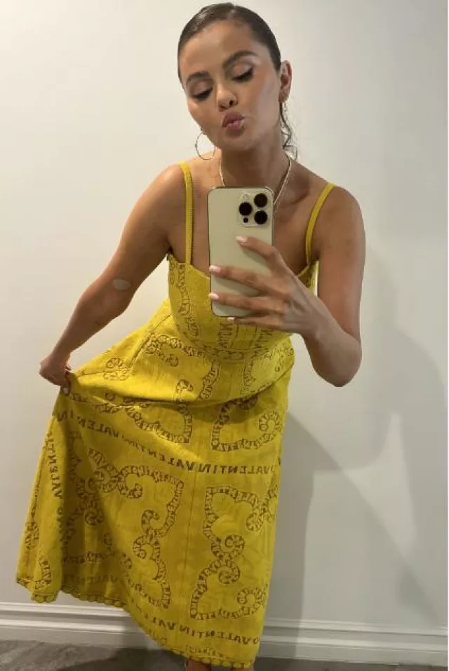 Valentino Logo Lace Cotton Blend Midi Dress worn by Selena Gomez on her Instagram Story on August 15, 2023