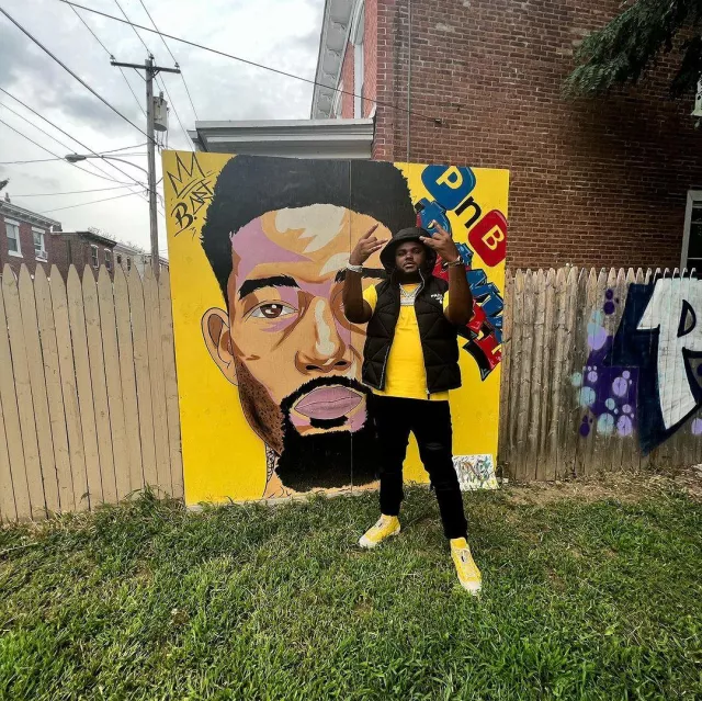 Dior Yellow Astro Logo B23 High Top Sneakers porté par Tee Grizzley sur son compte Instagram @teegrizzley