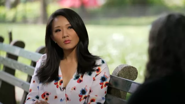Halogen Cross Front Blouse In White Multi Floral Paint worn by Nancy Chen as seen in CBS Mornings on September 3, 2023