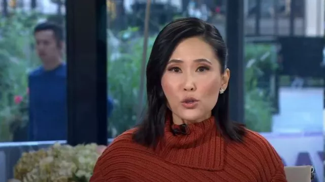 Staud Engrave Asymmetric Sweater in Cinnamon worn by Vicky Nguyen as seen in Today on September 21, 2023