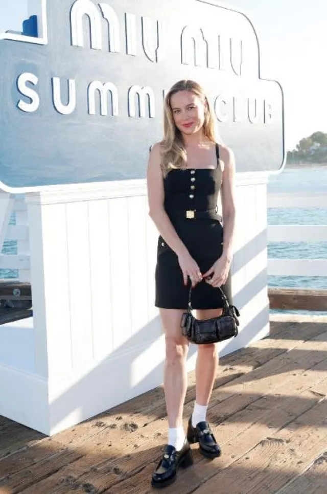Miu Miu Nap­pa Leather Hobo Bag worn by Brie Larson at Miu Miu Summer Club Beach Party post on July 26, 2023